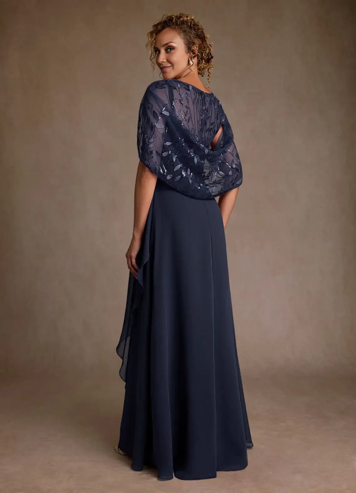 Round neck cape sleeve mother of the bride dress with embroidered tulle bodice, defined waist, and floor-length A-line skirt